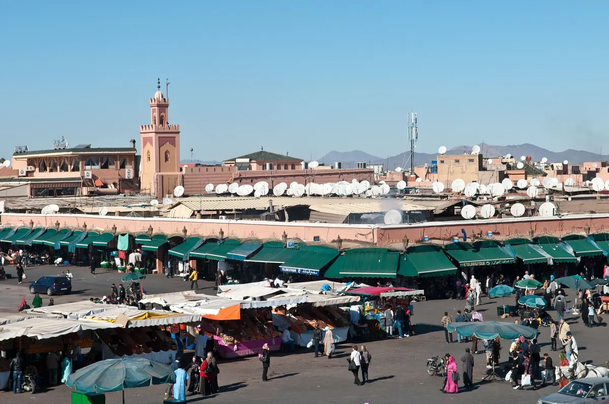 Market stalls with green awnings on the square