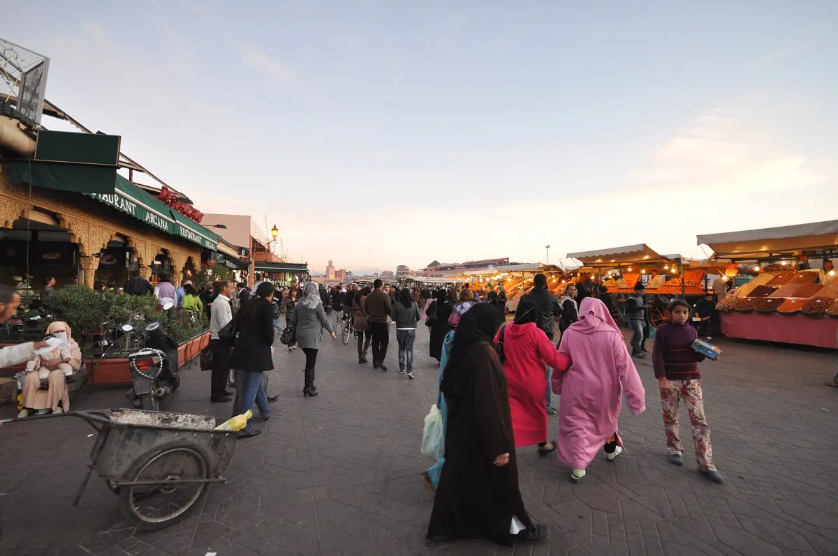 Visitors walking across Jemaa el-Fna